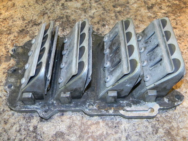 Johnson Evinrude reed valve plate assy from a 1967 100 hp V4
